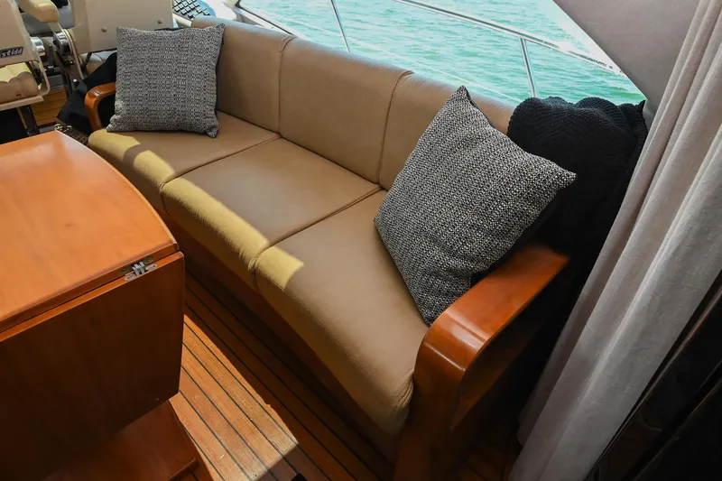 Slide: The Image of Luxurious interior of 2007 Sea Ray 60 Sundancer yacht with comfortable seating and cushions. - 40