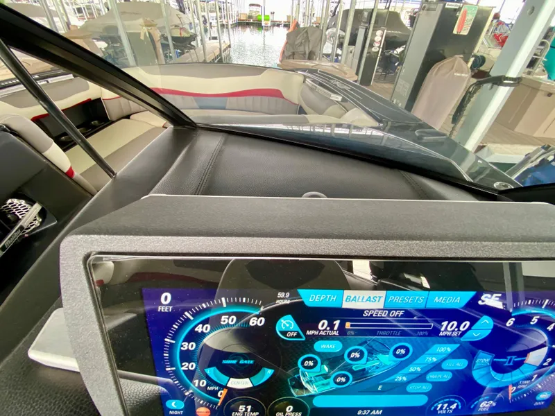 Slide: The Image of 2015 Malibu Wakesetter 22 MXZ dashboard with digital display and interior view. - 18