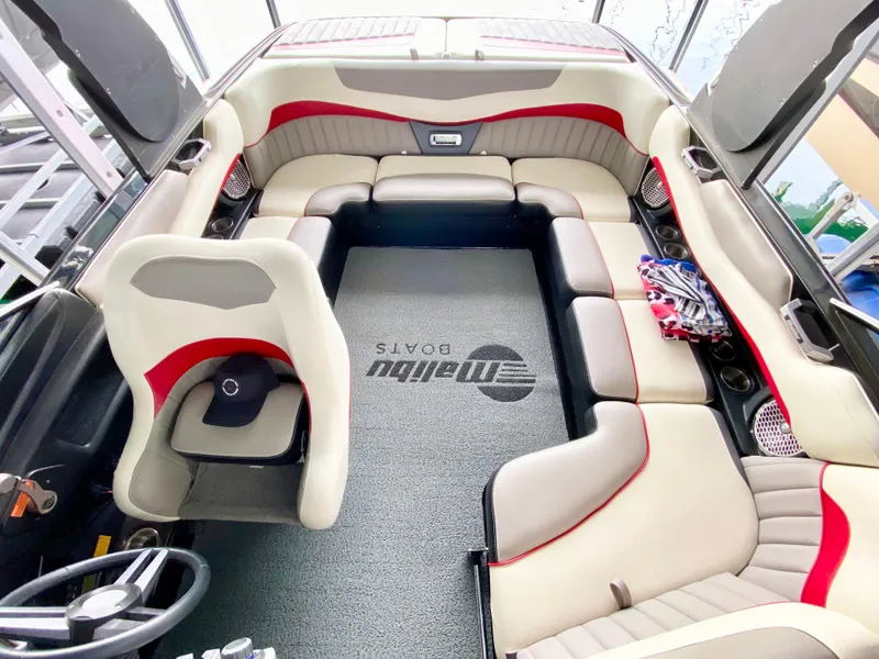 Slide: The Image of Interior of 2015 Malibu Wakesetter 22 MXZ boat with spacious seating and stylish design. - 23