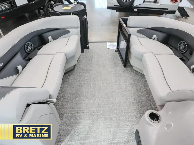 Slide: The Image of Luxurious interior of 2025 Aria 22QC pontoon boat with plush seating and modern design. - 10