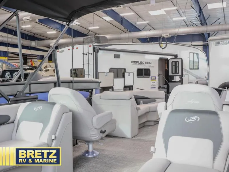 Slide: The Image of Interior view of a 2025 Aria 22QC at Bretz RV & Marine showroom. - 11