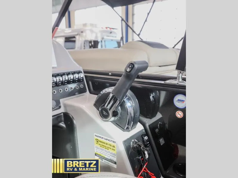 Slide: The Image of Control panel of 2025 Aria 22QC boat at Bretz RV & Marine showroom. - 14