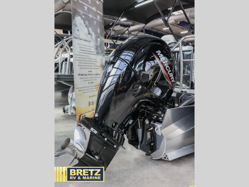 Slide: The Image of 2025 Aria 22QC boat with Mercury outboard motor at Bretz RV & Marine showroom. - 6