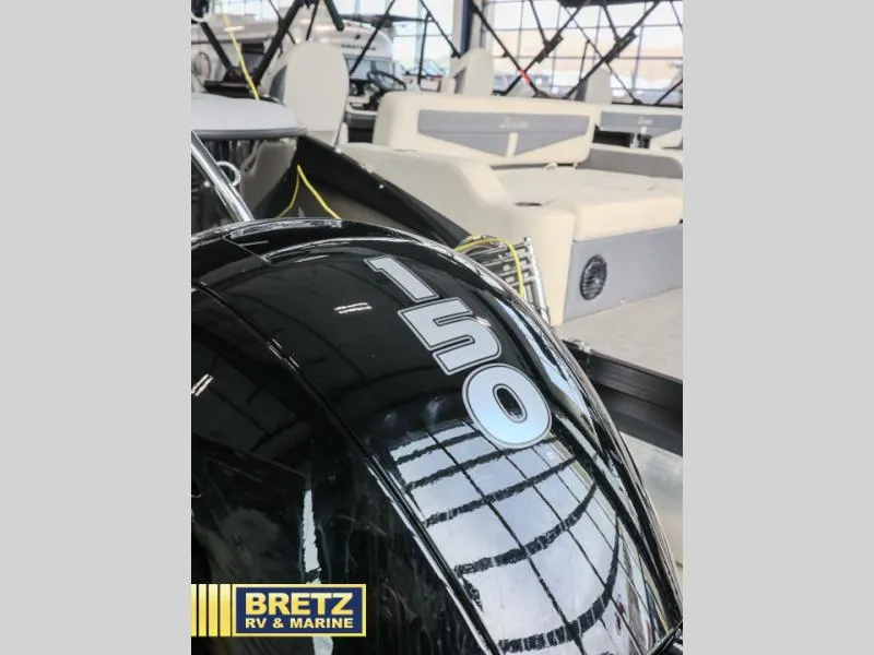 Slide: The Image of 2025 Aria 22QC boat with 150 horsepower engine at Bretz RV & Marine showroom. - 7