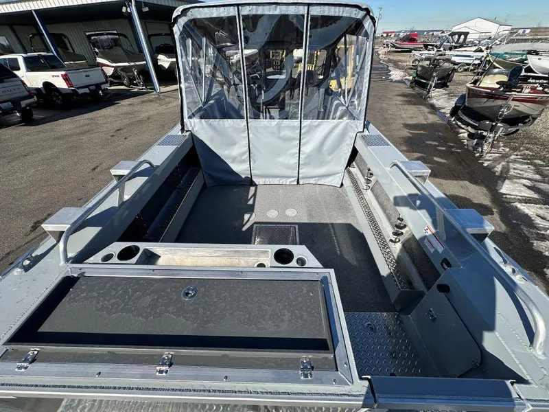 Slide: The Image of 2025 Hewescraft 210 Sea Runner ET boat interior with seating and storage compartments. - 4