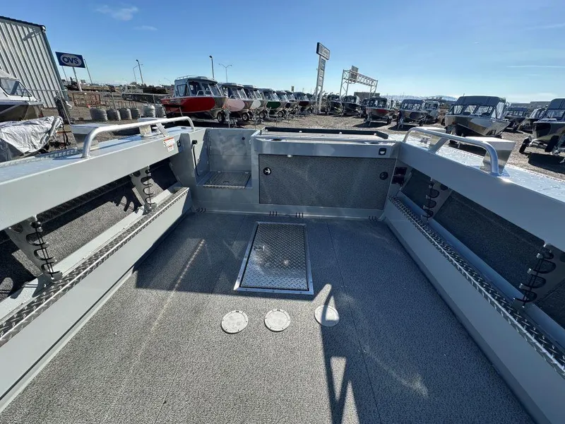 Slide: The Image of 2025 Hewescraft 210 Sea Runner ET boat interior, showcasing spacious deck and storage compartments. - 8