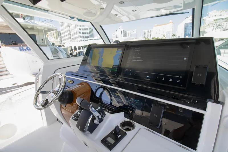 Slide: The Image of Helm of 2025 HCB 56 Suenos GIX with advanced navigation displays and controls. - 6