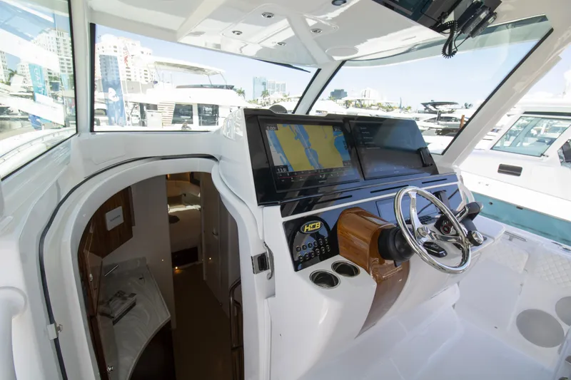 Slide: The Image of 2025 HCB 56 Suenos GIX helm with advanced navigation system and luxurious interior. - 7