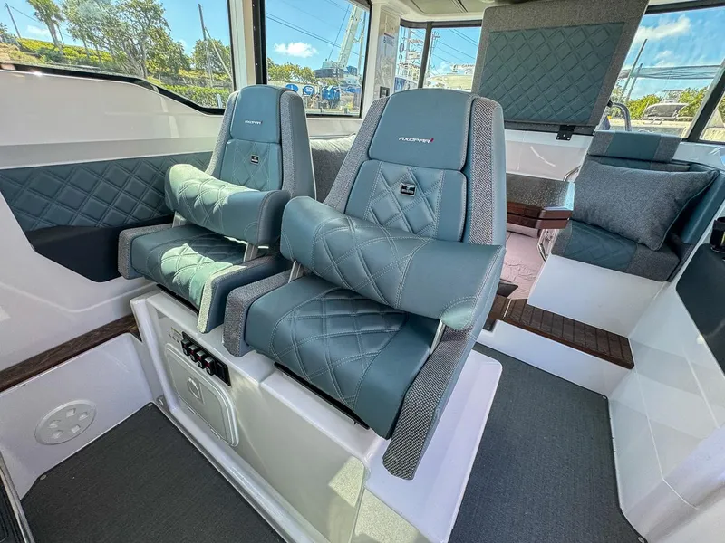 Slide: The Image of 2024 Axopar Sun Top interior with luxurious seating and modern design. - 17