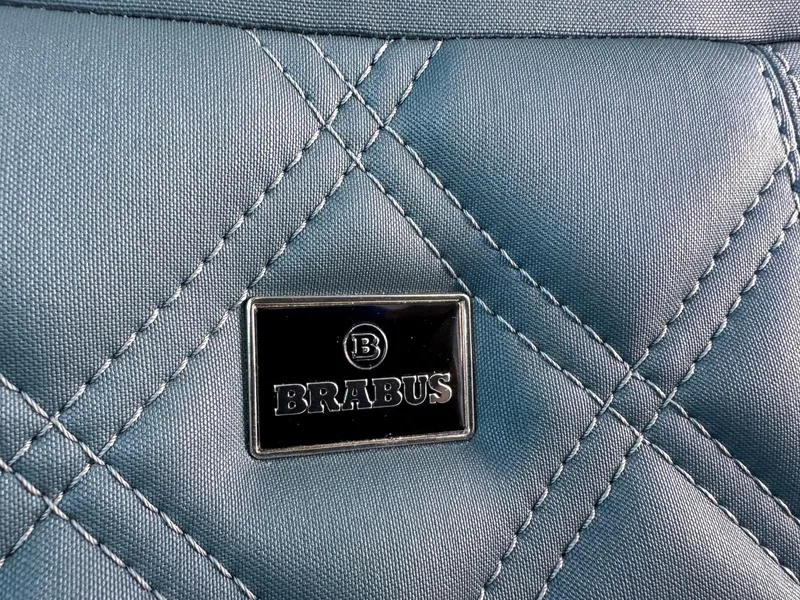 Slide: The Image of Quilted blue fabric with Brabus logo on 2024 Axopar Sun Top. - 18