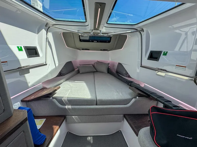 Slide: The Image of 2024 Axopar Sun Top cabin interior with skylights and modern design. - 20
