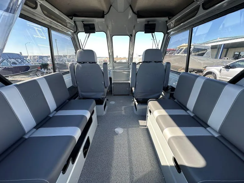 Slide: The Image of Interior of 2025 Hewescraft 210 Sea Runner ET HT, featuring spacious seating and large windows. - 5