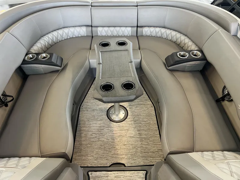 Slide: The Image of Luxurious seating area in 2025 Bennington R 24 RTFBA boat with cup holders and table. - 13