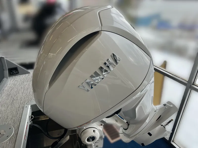 Slide: The Image of 2025 Bennington R 24 RTFBA with Yamaha outboard motor, sleek design. - 14