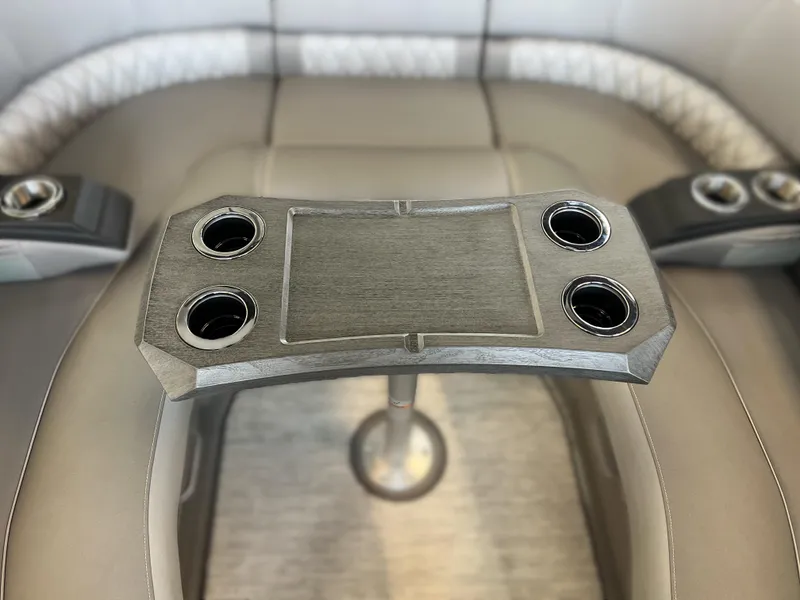 Slide: The Image of Bennington R 24 RTFBA 2025 boat interior with cup holders and seating. - 15