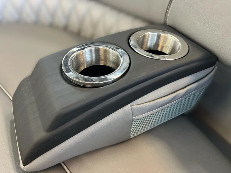 Slide: The Image of 2025 Bennington R 24 RTFBA boat cup holders on a sleek, modern armrest. - 16