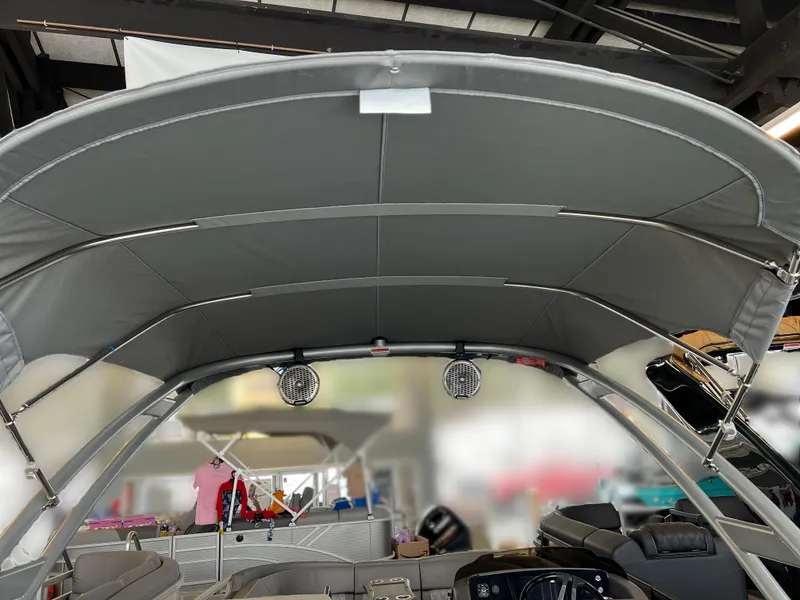 Slide: The Image of 2025 Bennington R 24 RTFBA boat interior with canopy and seating. - 5