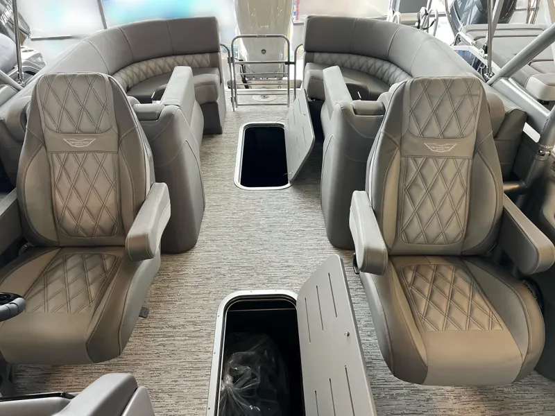 Slide: The Image of 2025 Bennington R 24 RTFBA boat interior with luxurious seating and storage compartments. - 7
