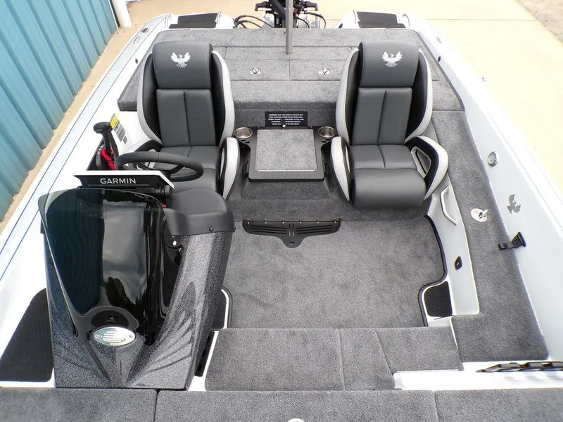 Slide: The Image of 2025 Phoenix 818 Pro boat interior with dual seats and Garmin equipment. - 10
