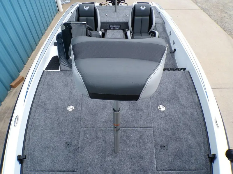 Slide: The Image of 2025 Phoenix 818 Pro boat interior with gray seating and carpeted deck. - 11