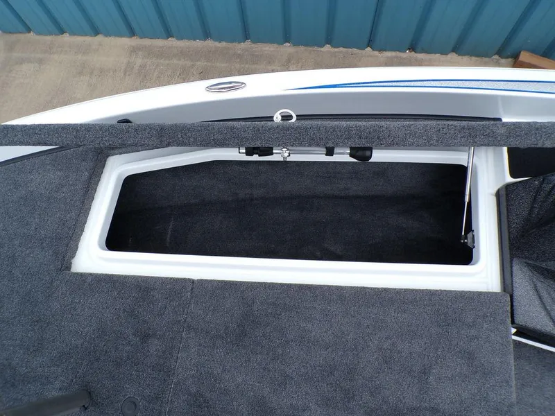 Slide: The Image of Storage compartment of 2025 Phoenix 818 Pro boat, featuring carpeted interior and sleek design. - 13