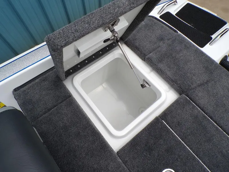 Slide: The Image of Phoenix 818 Pro 2025 boat storage compartment with open lid, showcasing interior space. - 2