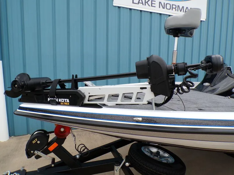 Slide: The Image of 2025 Phoenix 818 Pro boat with Minn Kota Ultrex motor, parked at Lake Norman. - 21