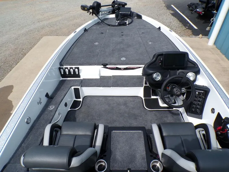 Slide: The Image of 2025 Phoenix 818 Pro boat interior with modern dashboard and seating. - 22
