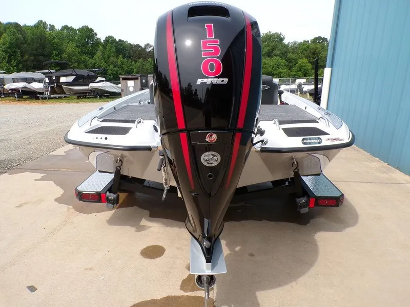 Slide: The Image of 2025 Phoenix 818 Pro boat with 150 horsepower engine, parked outdoors. - 23