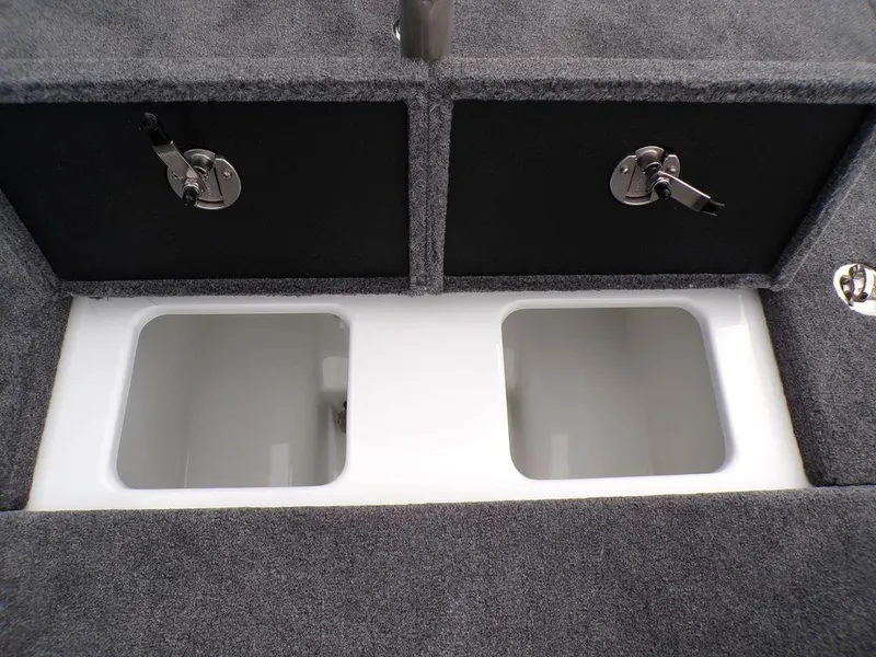 Slide: The Image of 2025 Phoenix 818 Pro boat storage compartments with secure latches and carpeted finish. - 3
