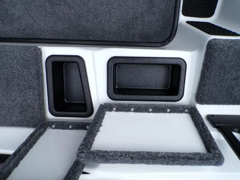 Slide: The Image of Interior compartments of 2025 Phoenix 818 Pro boat, featuring carpeted storage areas. - 4