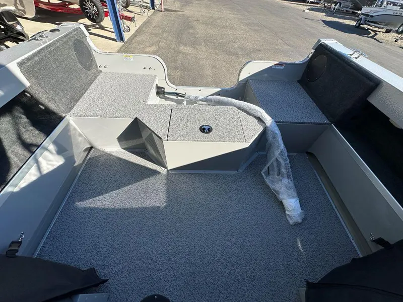 Slide: The Image of 2025 Smoker Craft Osprey 172 boat interior with spacious deck and storage compartments. - 5