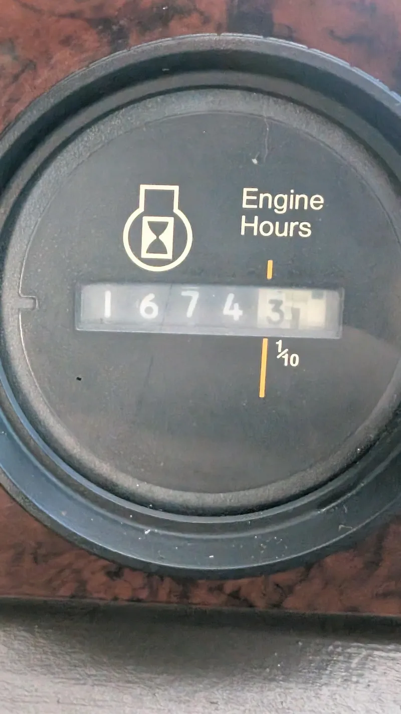 Slide: The Image of Engine hour meter showing 1674.3 hours on 1987 Sea Ray 390 Express Cruiser. - 25