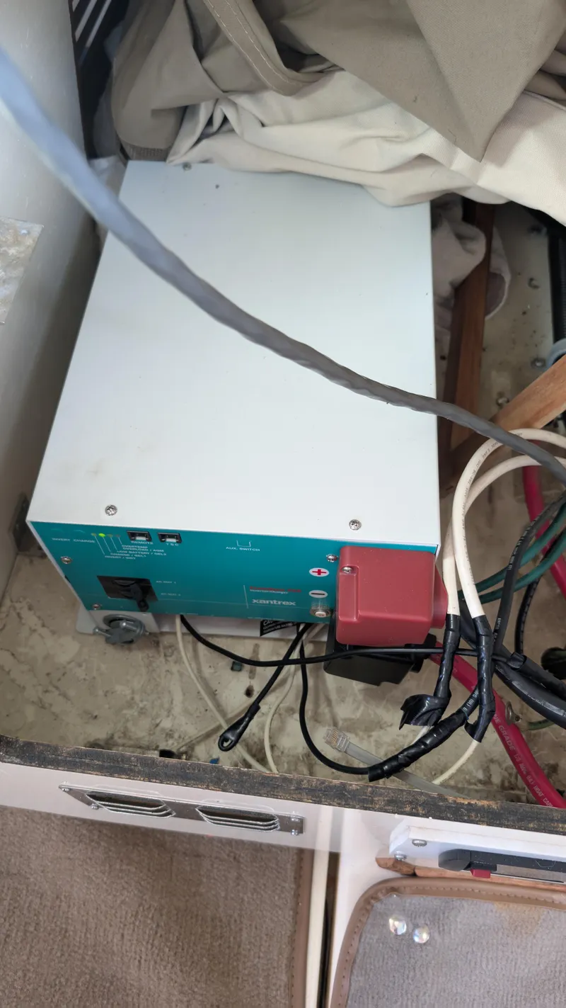 Slide: The Image of Electrical equipment inside a 1987 Sea Ray 390 Express Cruiser boat. - 28