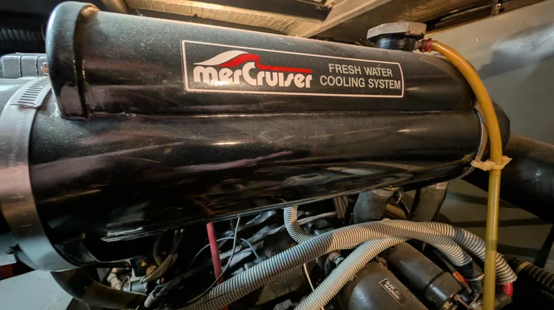 Slide: The Image of MerCruiser fresh water cooling system in 1987 Sea Ray 390 Express Cruiser engine compartment. - 40