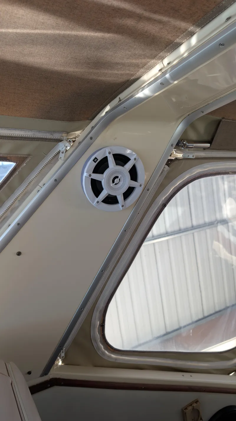 Slide: The Image of 1987 Sea Ray 390 Express Cruiser interior with speaker and window detail. - 44