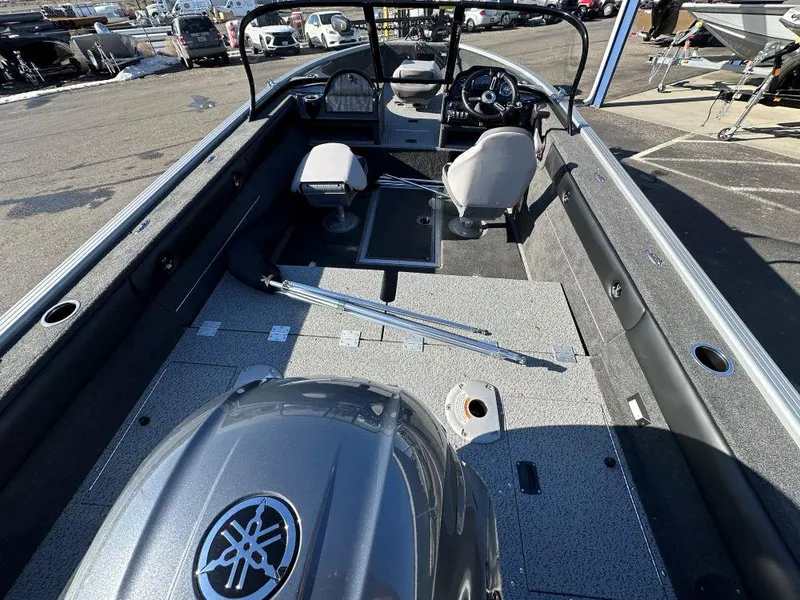 Slide: The Image of Starweld Fusion 18 DC 2025 boat interior with seating and steering console. - 5