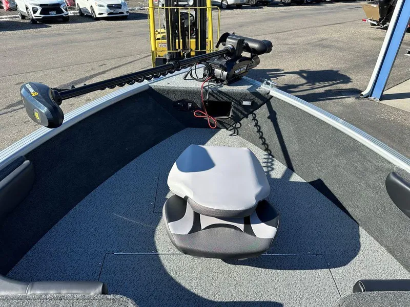 Slide: The Image of 2025 Starweld Fusion 18 DC boat interior with trolling motor and seating. - 6