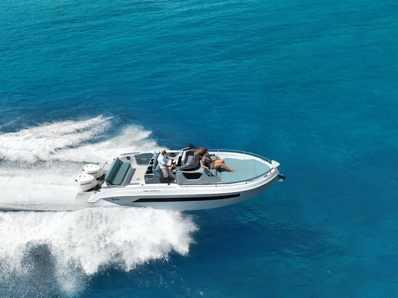Slide: The Image of 2025 Ranieri NEXT 275 LX speedboat cruising on clear blue ocean waters. - 4