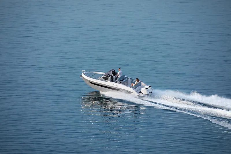 Slide: The Image of 2025 Ranieri NEXT 275 LX speedboat cruising on open water. - 7