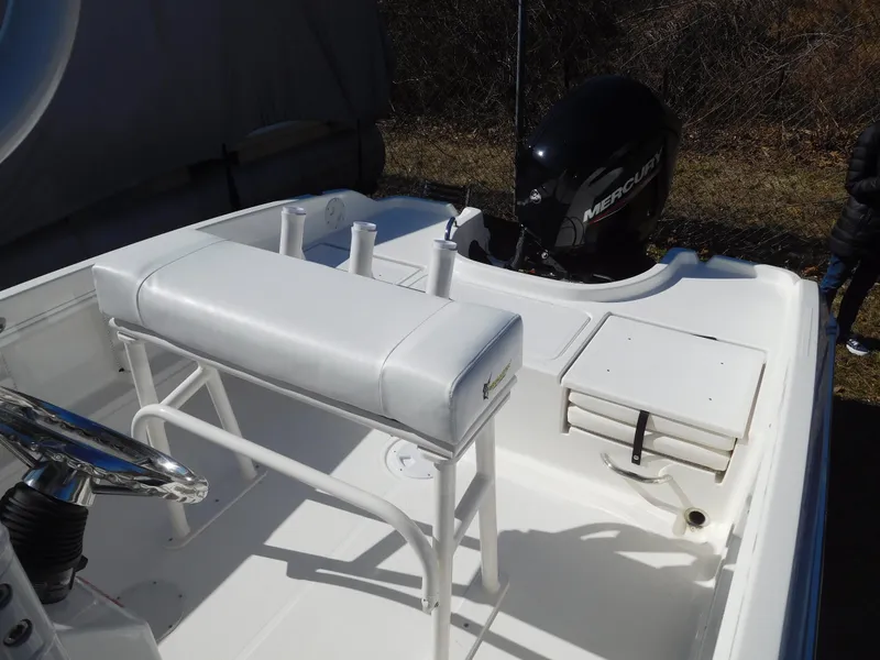 Slide: The Image of 2025 Bayliner Trophy T18Bay boat interior with seating and Mercury outboard motor. - 13