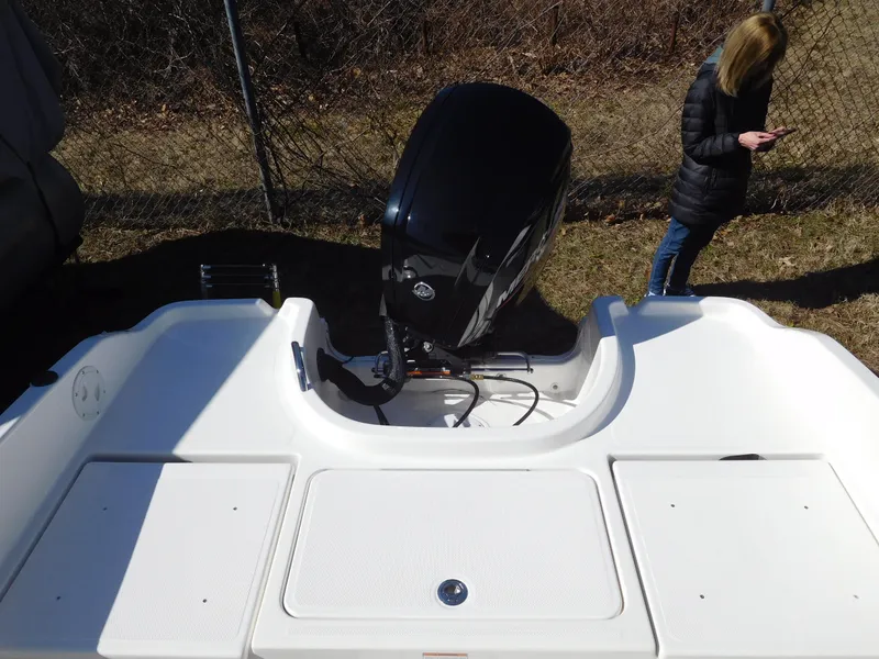 Slide: The Image of 2025 Bayliner Trophy T18Bay boat with outboard motor, viewed from above. - 14