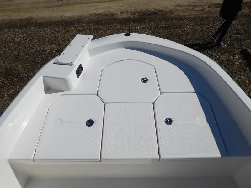 Slide: The Image of 2025 Bayliner Trophy T18Bay boat deck with storage compartments. - 16