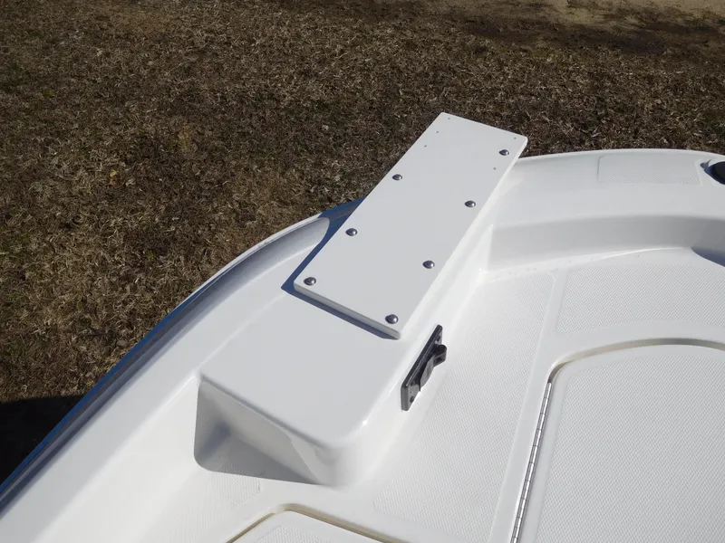 Slide: The Image of Bayliner Trophy T18Bay 2025 boat deck detail with white finish and mounting plate. - 18
