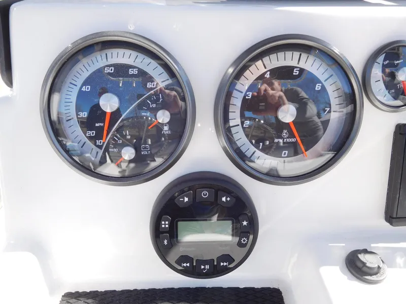 Slide: The Image of Dashboard of 2025 Bayliner Trophy T18Bay boat with speedometer and tachometer. - 22
