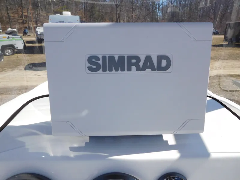 Slide: The Image of Simrad navigation system on 2025 Bayliner Trophy T18Bay boat dashboard. - 23