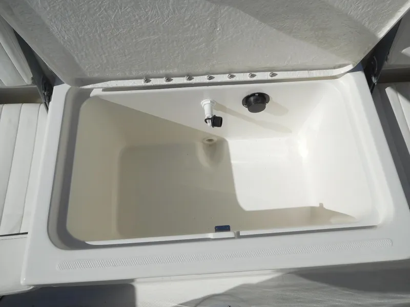 Slide: The Image of 2025 Bayliner Trophy T18Bay livewell compartment, open and empty. - 30