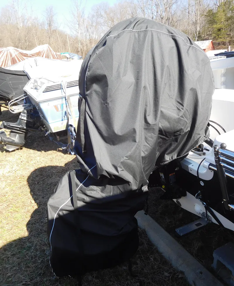 Slide: The Image of 2025 Bayliner Trophy T18Bay boat engine covered outdoors. - 33