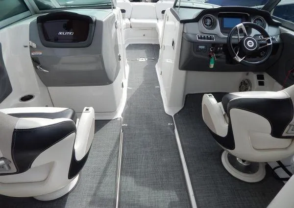 Slide: The Image of 2015 Chaparral 284 Sunesta boat interior with modern dashboard and seating. - 13