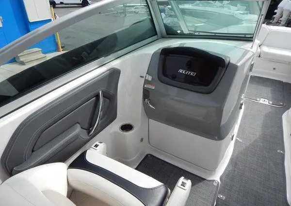 Slide: The Image of 2015 Chaparral 284 Sunesta boat interior with seating and dashboard view. - 16